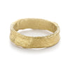 Alternative men's wedding band with a rugged textured finish in 18ct yellow gold from Ruth Tomlinson, handmade in London
