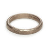A classic men's textured wedding band in white gold, handmade in London by Ruth Tomlinson