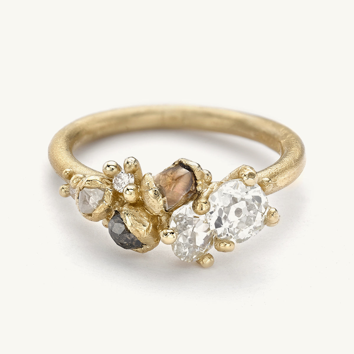 Alternative diamond cluster engagement ring from Ruth Tomlinson, handmade with recycled gold