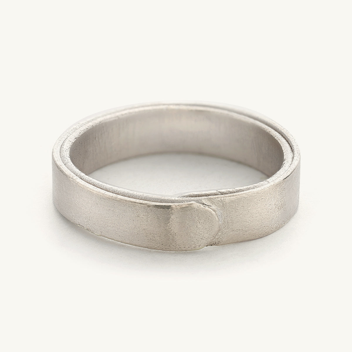 A 5mm wedding band for him from Ruth Tomlinson, handmade using recycled gold