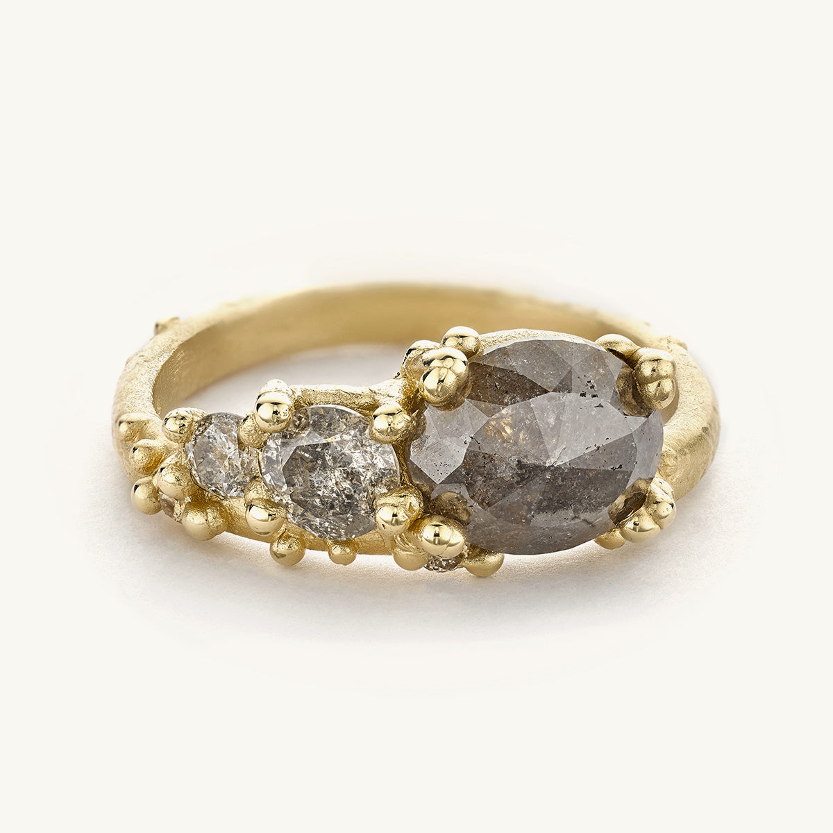 Alternative grey diamond engagement ring from Ruth Tomlinson, handmade using recycled gold