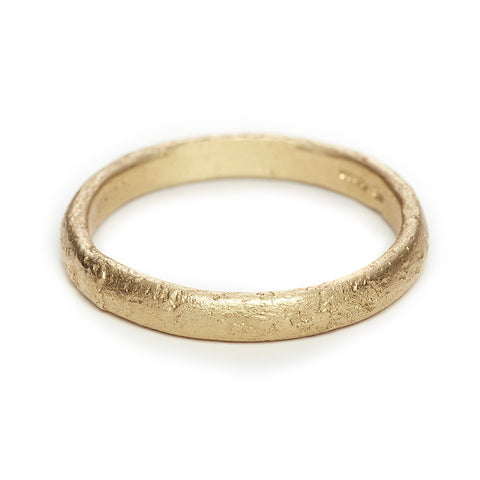 A classic men's textured wedding band in yellow gold, handmade in London by Ruth Tomlinson