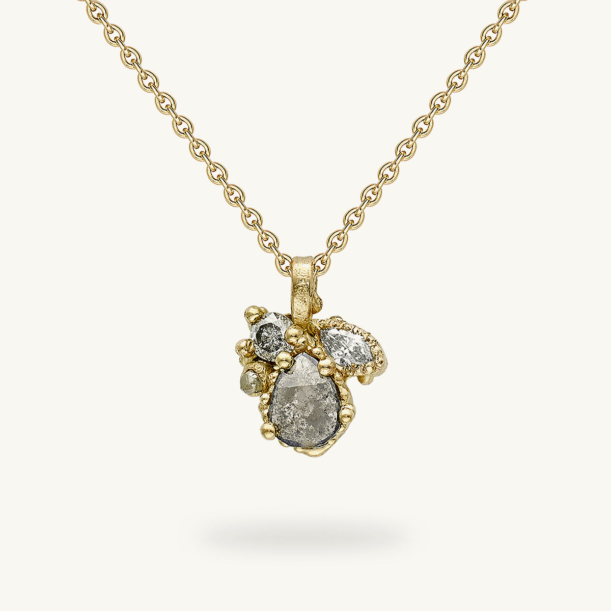 Decorative and alternative grey diamond cluster pendant designed by Ruth Tomlinson. Handmade in London with recycled gold and responsibly sourced gemstones.
