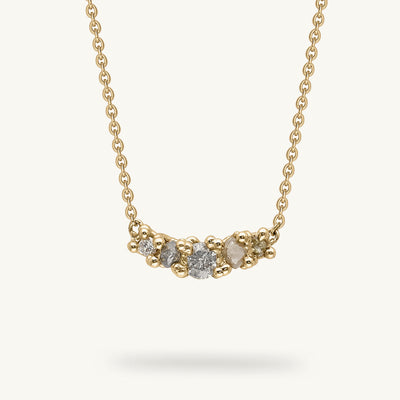 An alternative five stone diamond necklace from Ruth Tomlinson, handmade using recycled gold