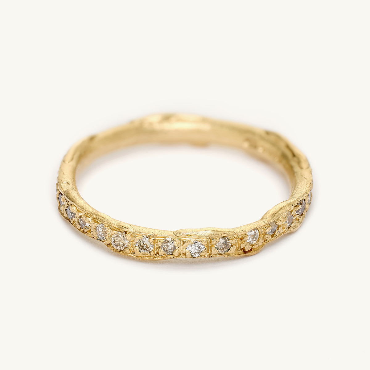 A mixed diamond eternity band from Ruth Tomlinson, handmade using recycled gold