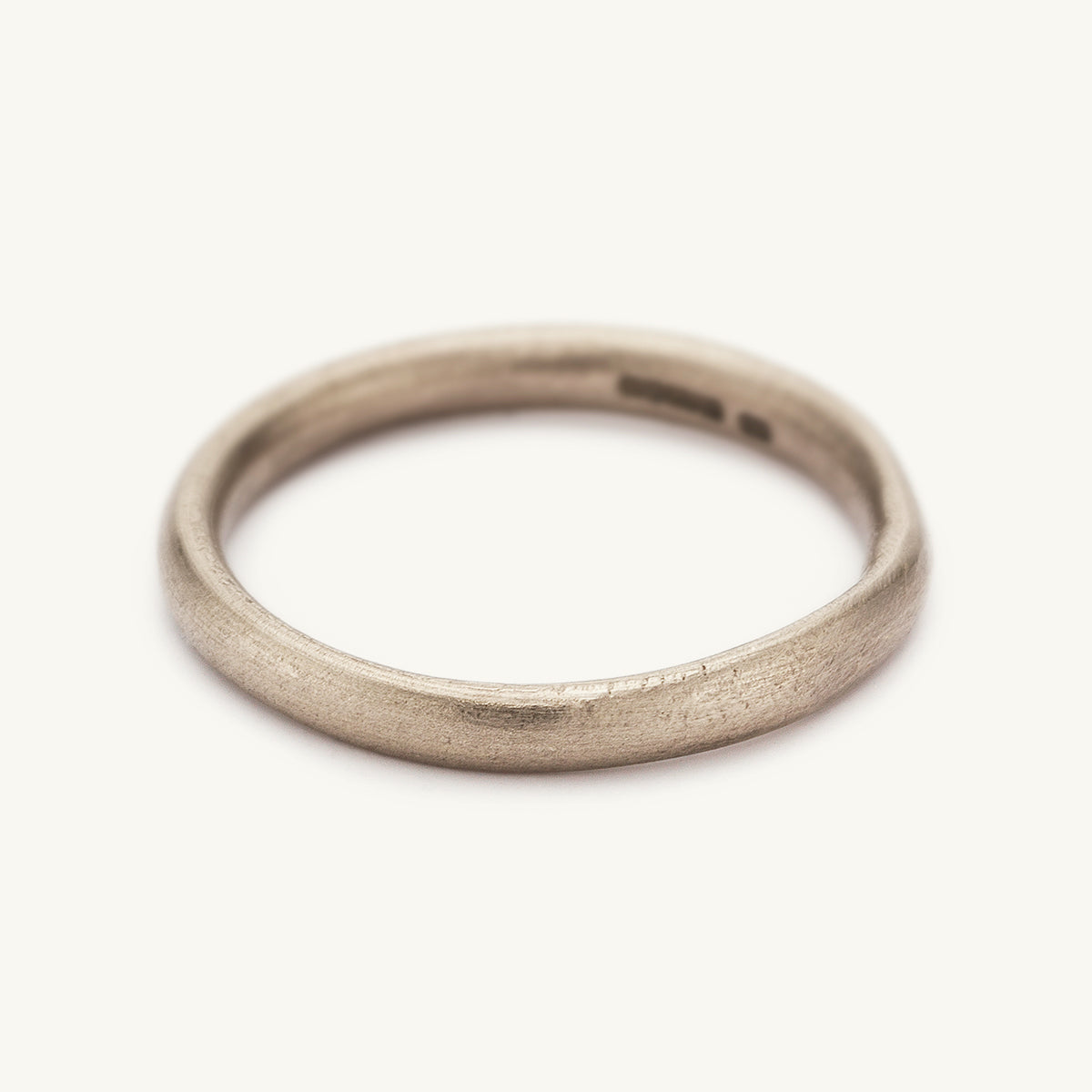 2.5mm wide wedding band from Ruth Tomlinson, handmade in recycled 18ct white gold