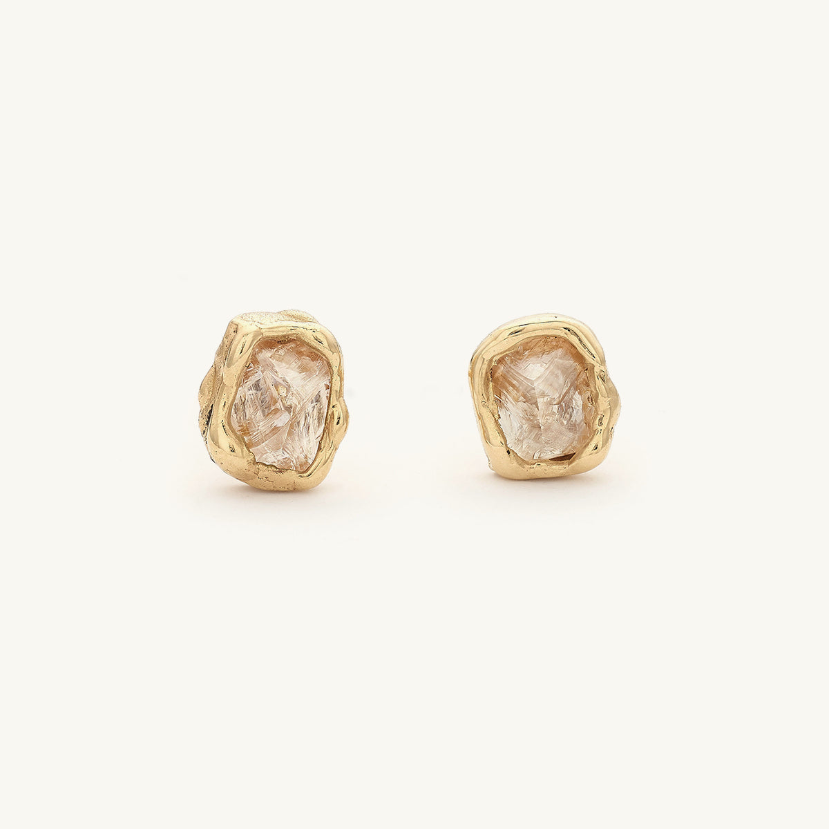 Raw champagne diamond studs from Ruth Tomlinson, handmade in recycled gold