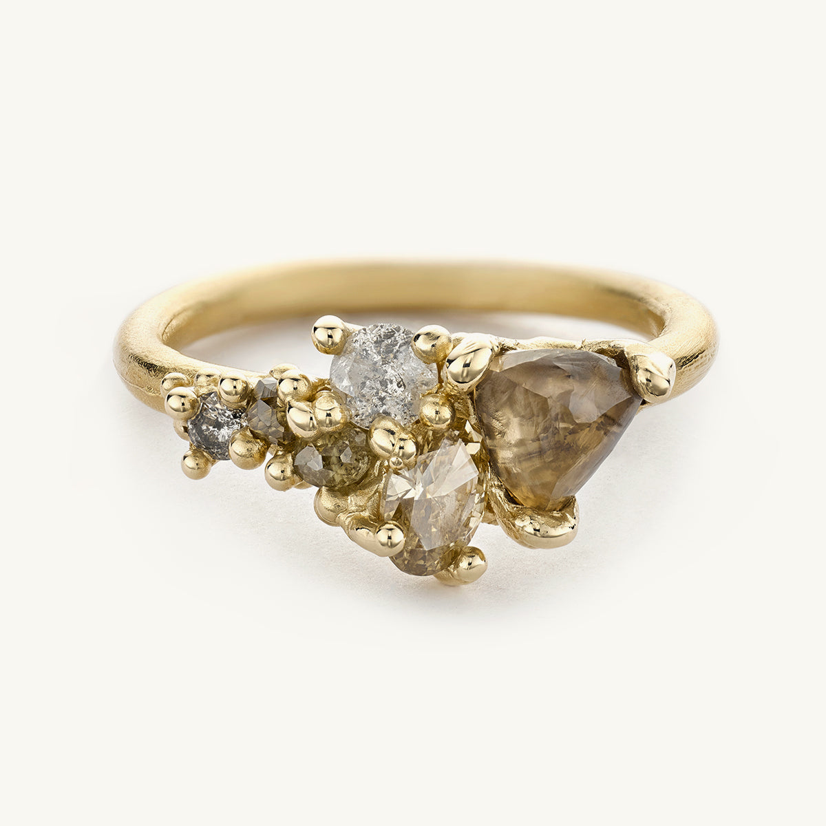 Champagne diamond cluster alternative engagement ring from Ruth Tomlinson, made from recycled gold