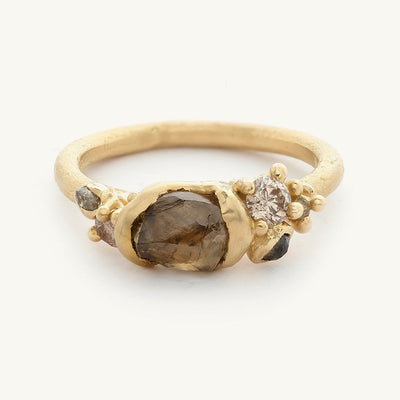 A raw champagne diamond engagement ring from Ruth Tomlinson, handmade using recycled gold