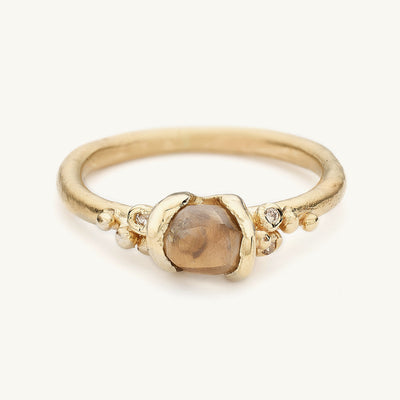 Raw diamond solitaire engagement ring from Ruth Tomlinson, made in recycled gold