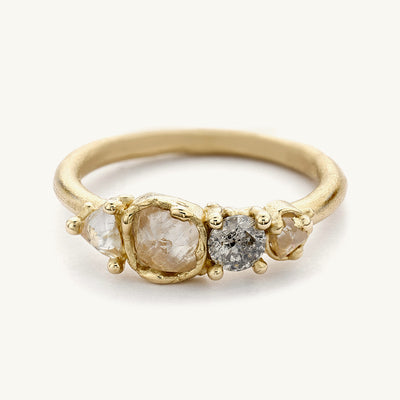 An understated raw diamond engagement ring from Ruth Tomlinson, handmade using recycled gold.