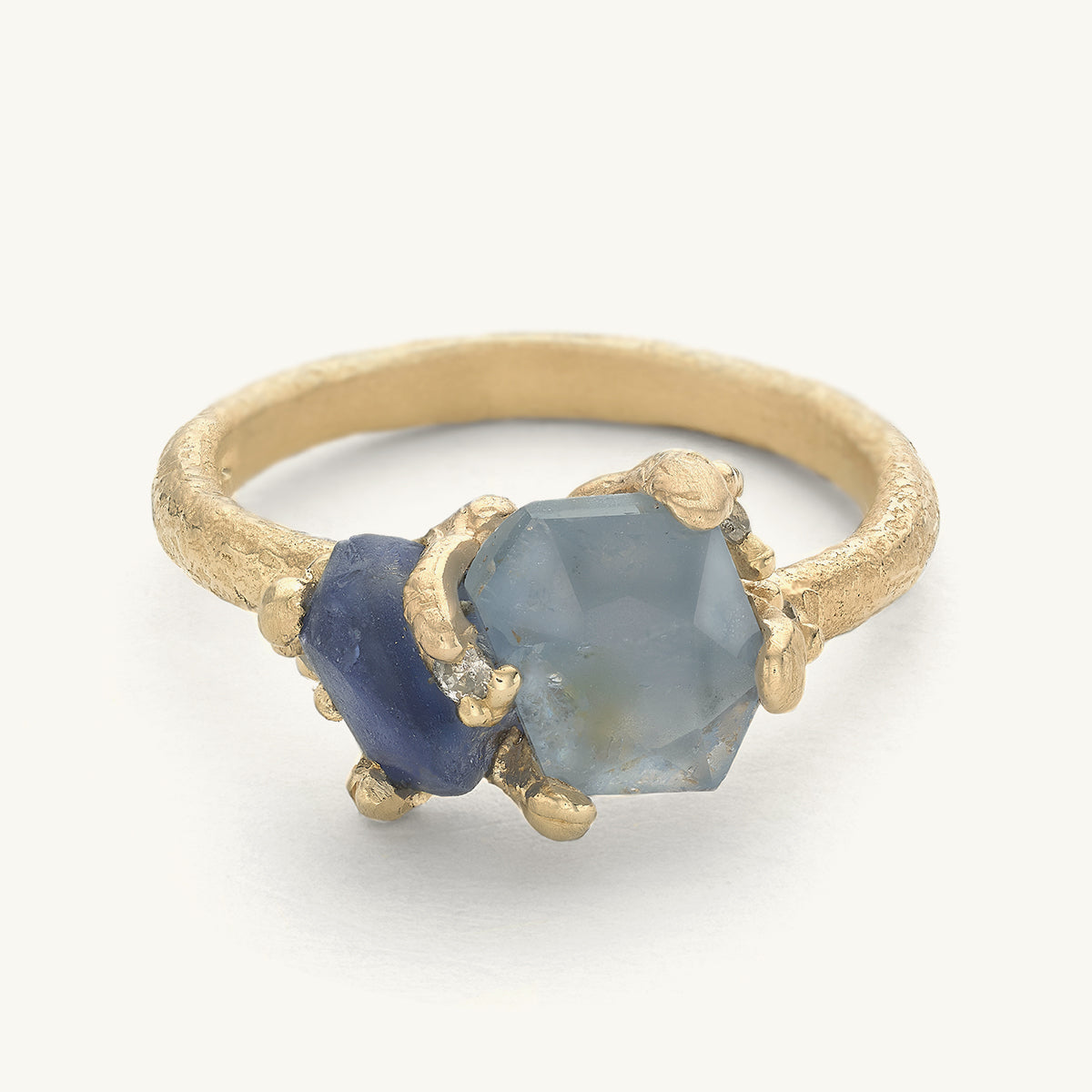 Two stone sapphire ring with diamond details on a gently textured band. Handcrafted in London with recycled gold and responsibly sourced gemstones. 