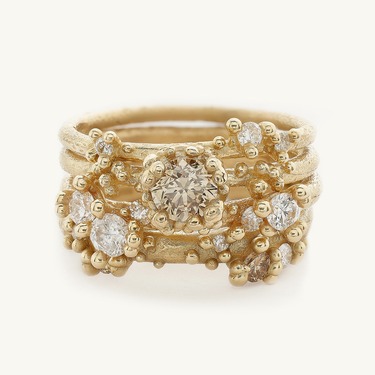 Ruth Tomlinson Alternative Ethereal Engagement Ring stack with champagne and white diamonds made from recycled gold