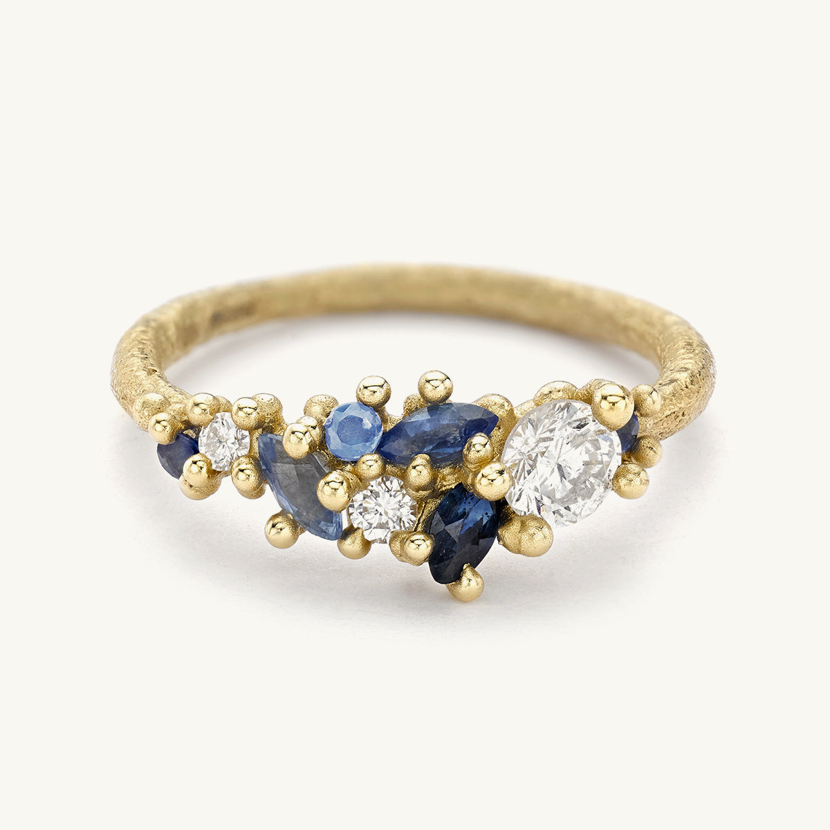 Ruth Tomlinson Diamond and Sapphire Tapering Cluster Ring Alternative Engagement Ring made from Recycled Gold