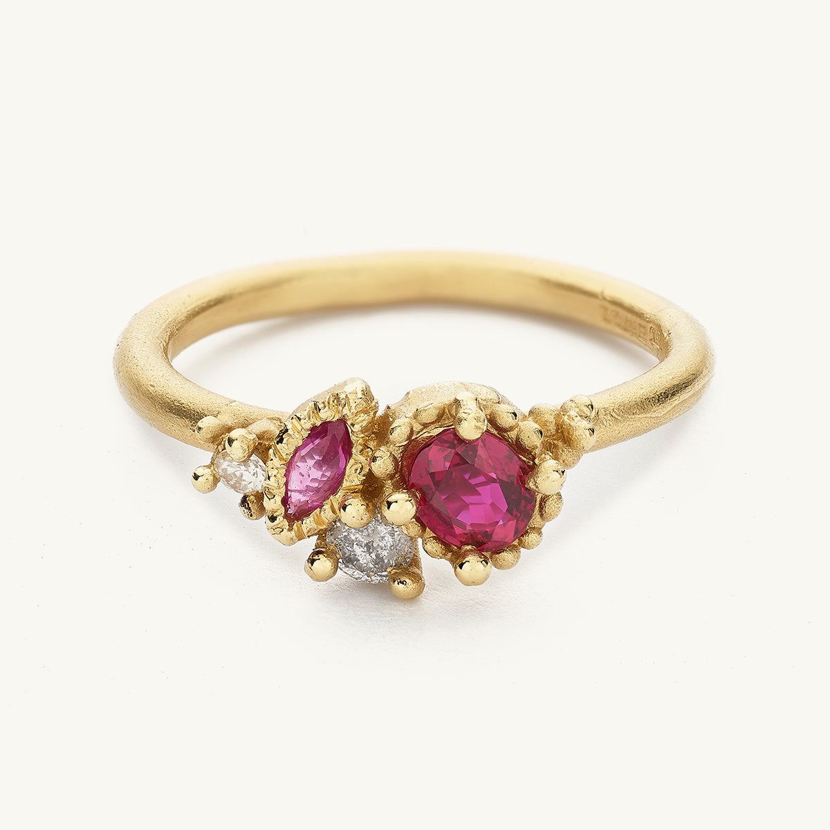 Ruth Tomlinson alternative engagement ring with rubies and diamonds in decorative settings made with recycled gold