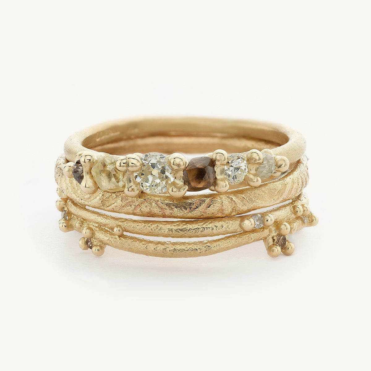 Ruth Tomlinson understated alternative engagement ring stack with raw diamonds made with recycled gold 