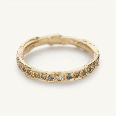 A mixed diamond eternity band from Ruth Tomlinson, handmade using recycled gold