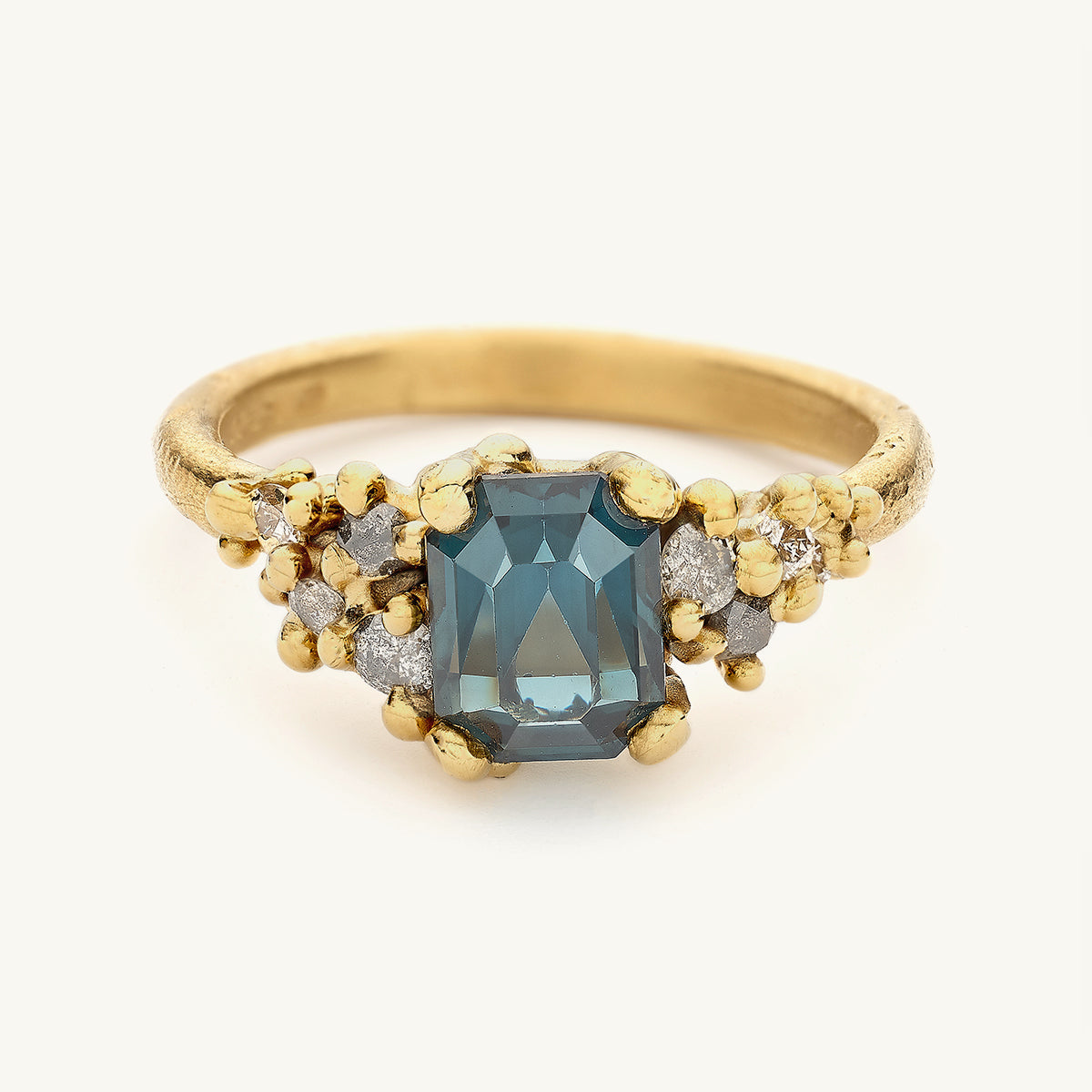 Ruth Tomlinson teal sapphire and grey diamond alternative engagement ring made from recycled gold
