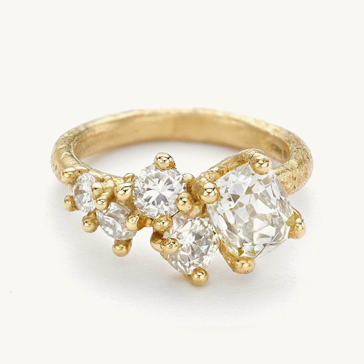 Ruth Tomlinson One of a Kind Paragon Tapering Custer Engagement Ring made with antique white diamonds and recycled gold 