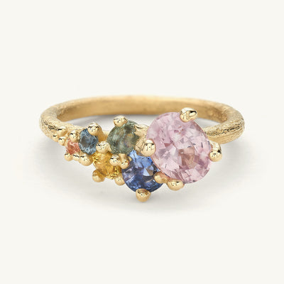 one-of-a-kind alternative engagement ring with a colourful cluster of sapphires and golden granules. Handcrafted in London with 100% recycled gold and responsibly sourced gemstones. 