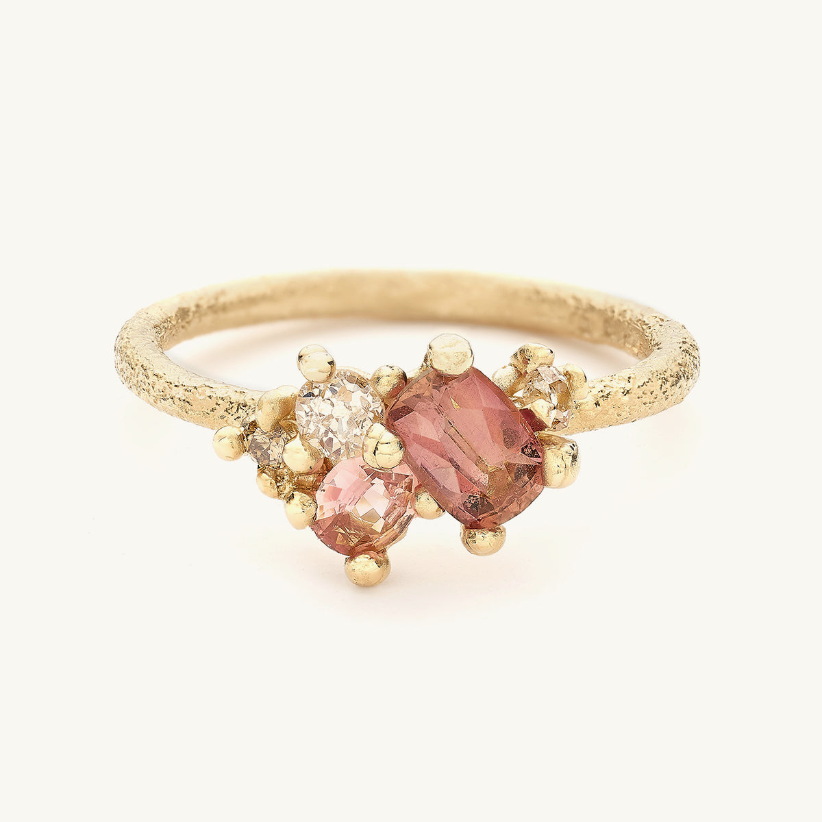 Ruth Tomlinson one of a kind peach sapphire and diamond alternative engagement ring made from recycled gold