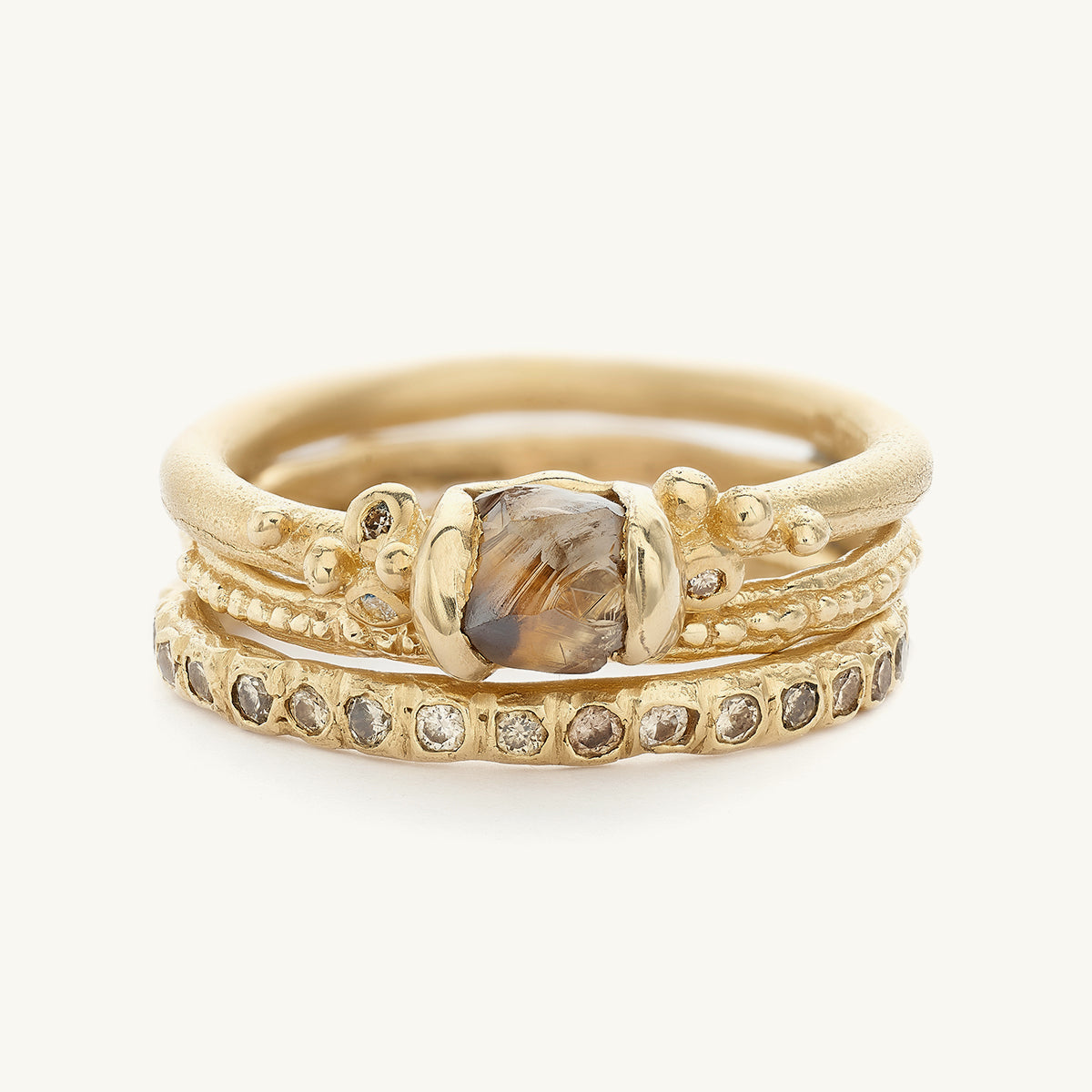 Ruth Tomlinson alternative bridal engagement ring stack with raw diamond made from recycled gold 