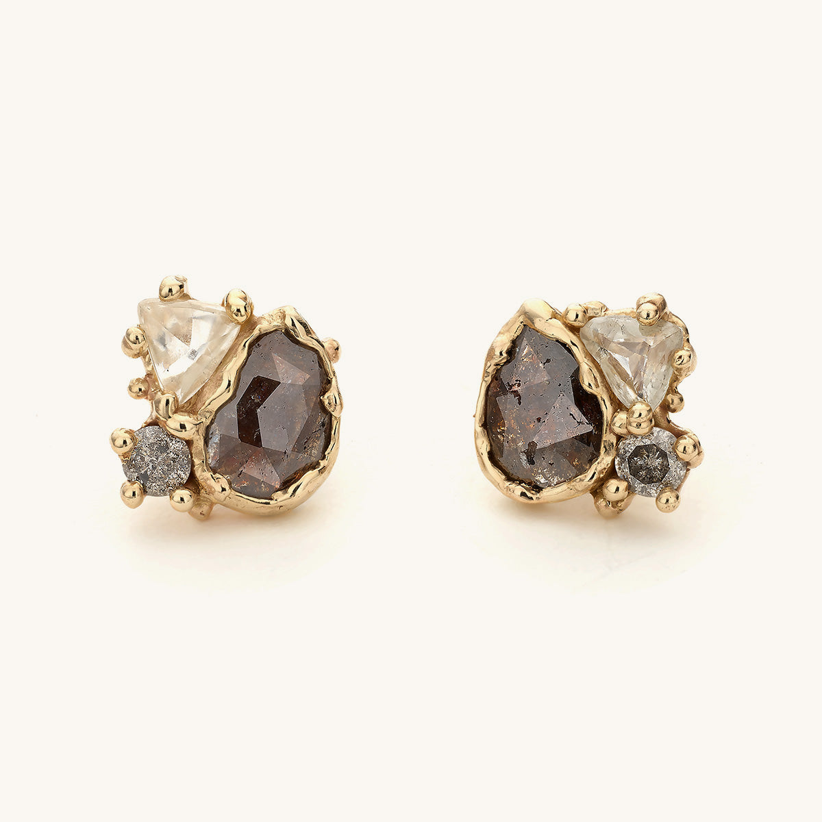 Alternative diamond stud earrings by Ruth Tomlinson, handcrafted with rose cut, raw and salt and pepper diamonds with organic gold details