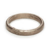 A classic men's textured wedding band in white gold, handmade in London by Ruth Tomlinson