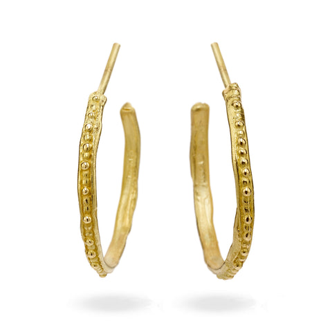 Gold hoop earrings from Ruth Tomlinson, handmade in London