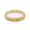 Decorative gold wedding band from Ruth Tomlinson, handmade in London